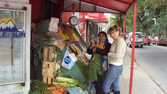 Fun Gals in Salta Ham it Up at the Fruit & Vegetable Stand